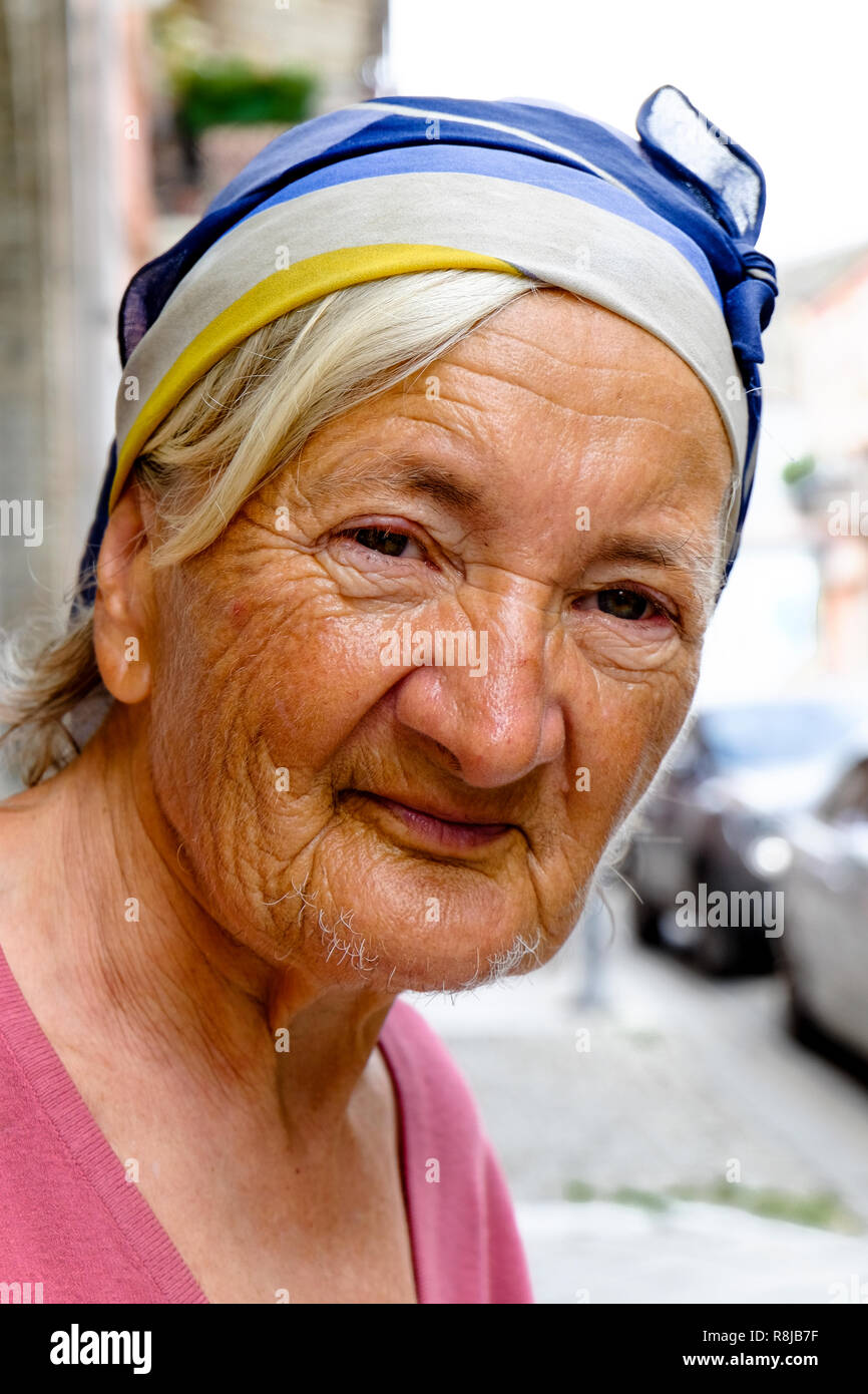 Portrait of old lady in the street Stock Photo