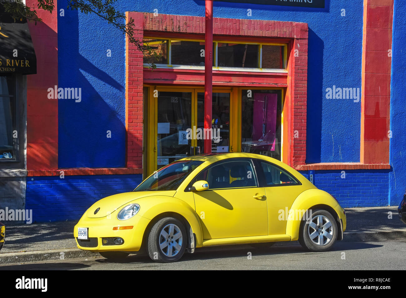 Yellow Beetle VW car in Victoria BC, Canada Stock Photo