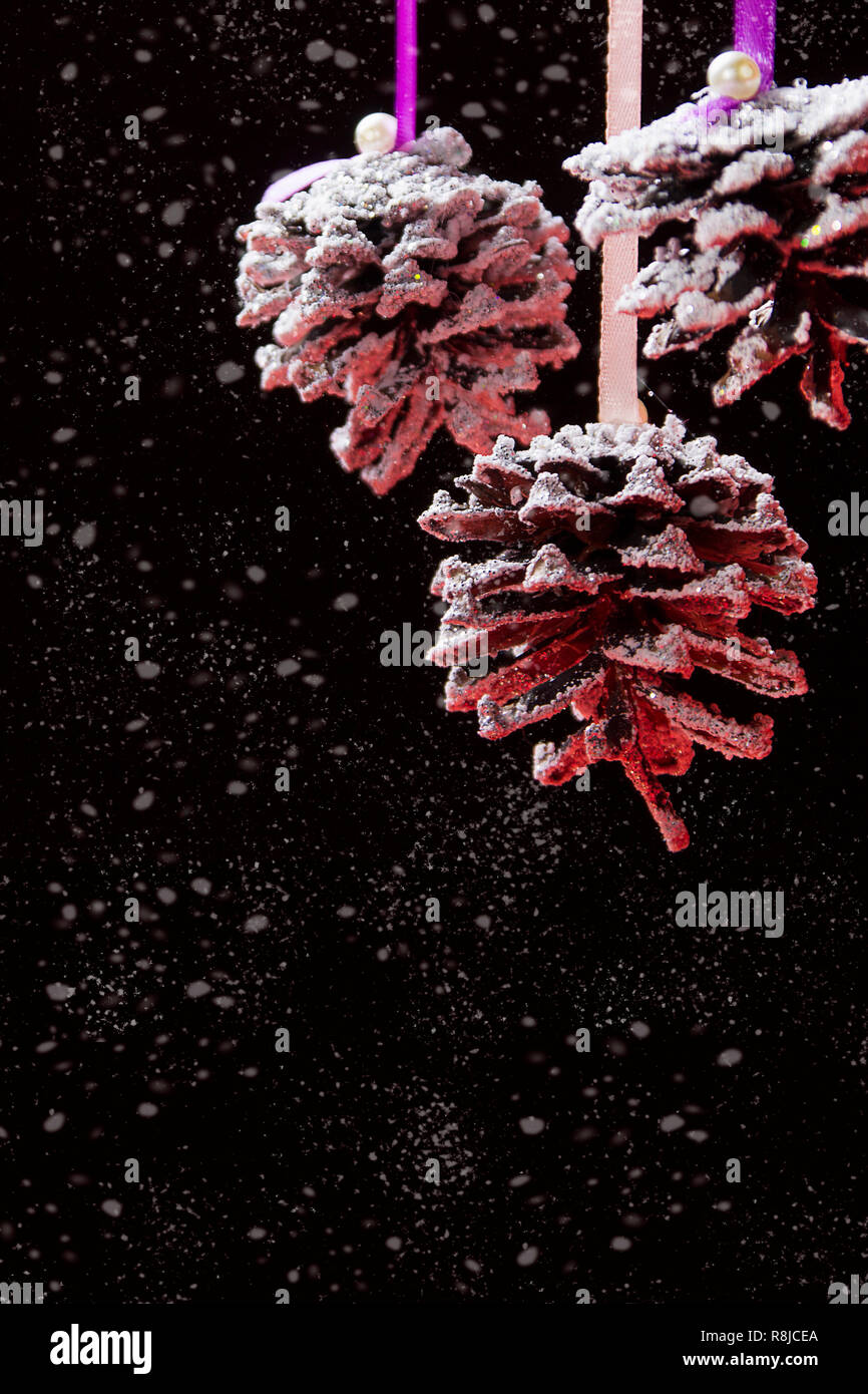 Christmas decorative bumps on a dark background with white snow ...