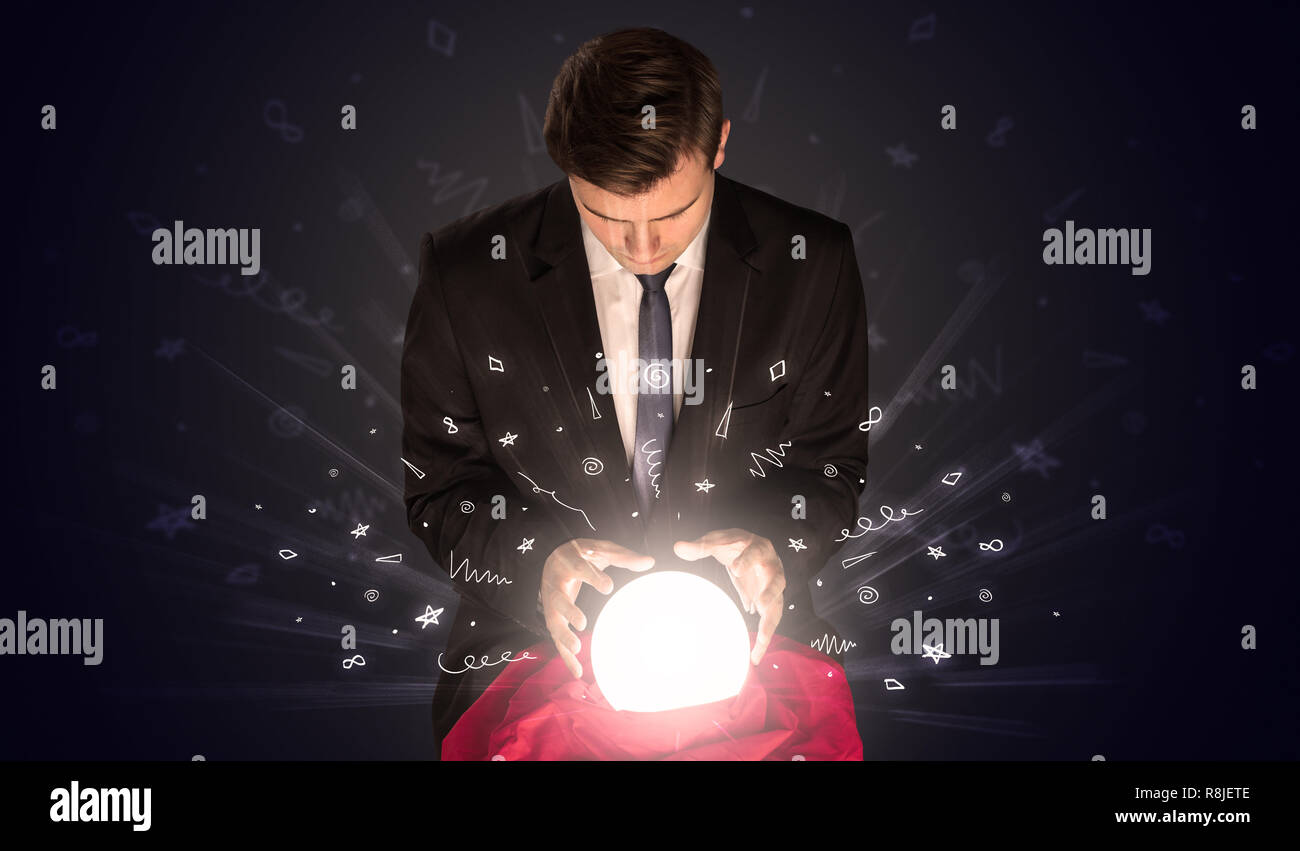 Businessman looking into crystal ball hi-res stock photography and ...