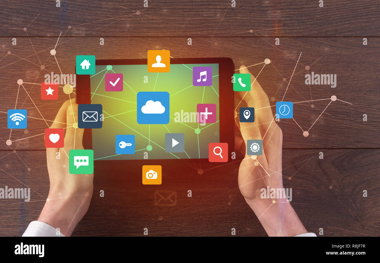 Hand touching multitask tablet with cloud wifi message social media ...