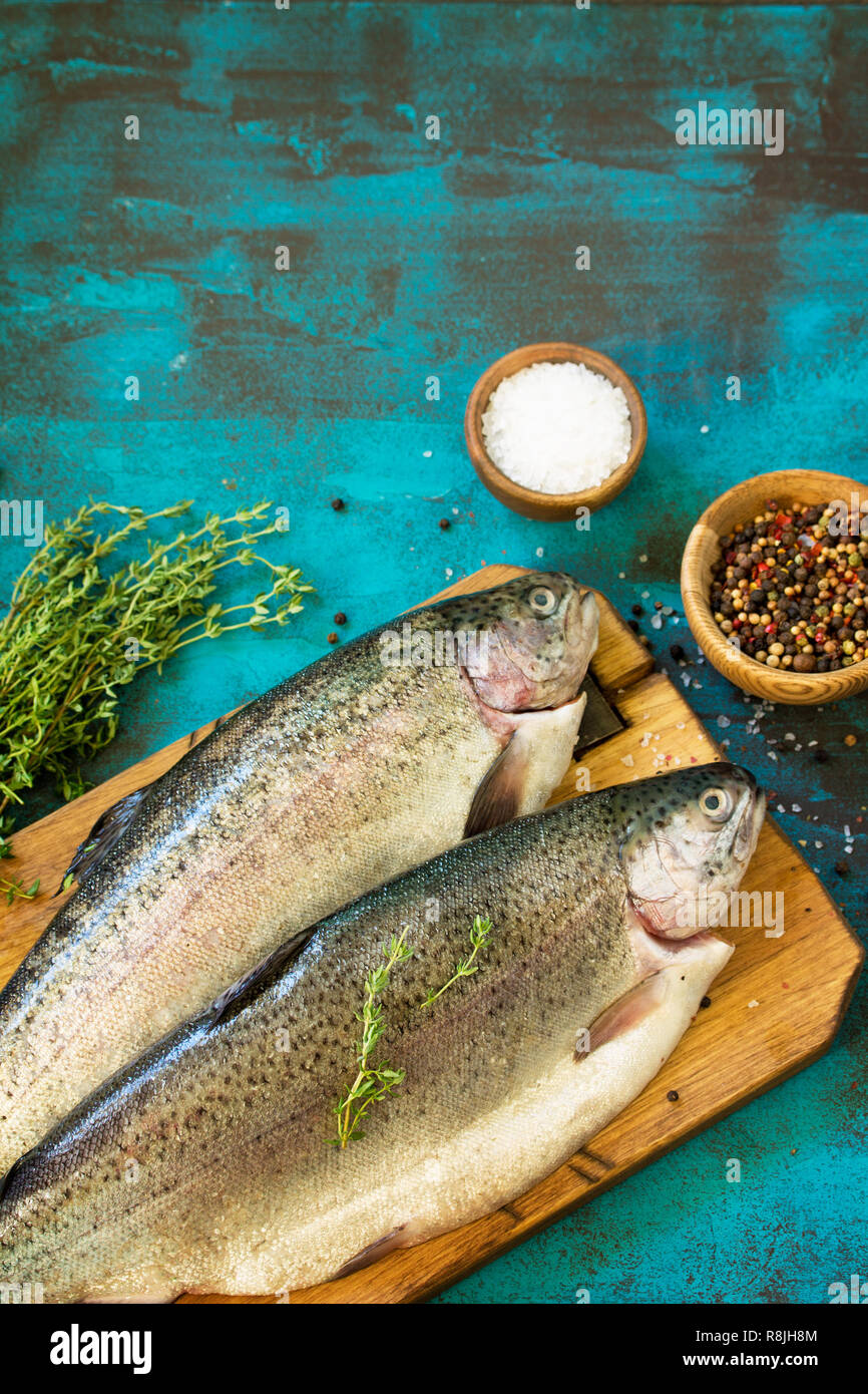 Fresh Fish. Raw Salmon and Spice on a blue slate table. Top view flat lay background. Copy space. Stock Photo