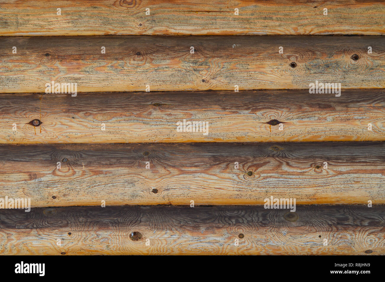 Texture of an old rustic wooden fence made of flat processed boards Stock Photo