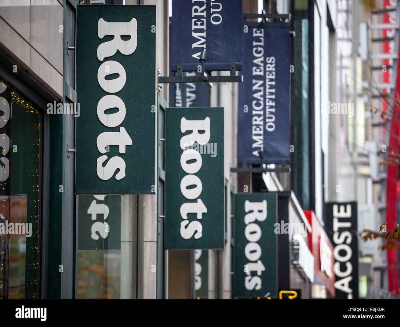 MONTREAL, CANADA - NOVEMBER 5, 2018: Roots Canada logo in front of their local boutique in Montreal. Roots Canada is a Canadian fashion retailer selli Stock Photo