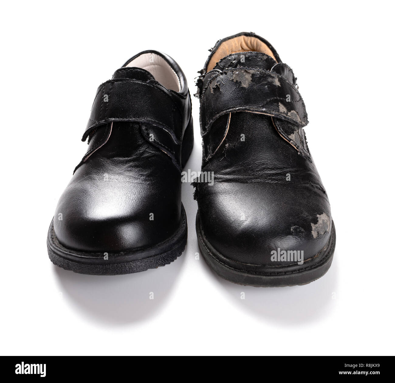 a new leather shoe and a damaged old one on white Stock Photo - Alamy