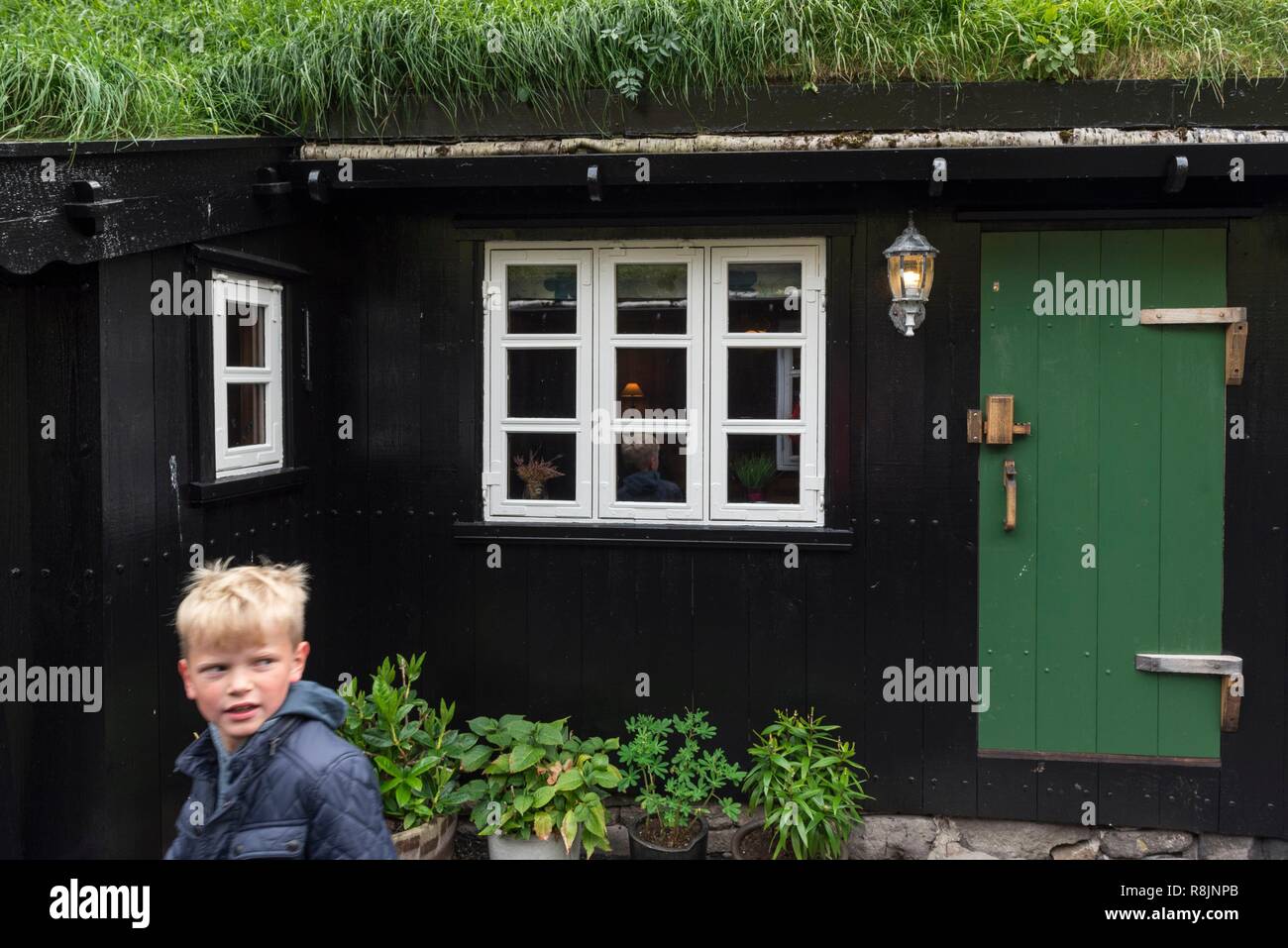 Denmark, Faroe Islands, Streymoy Island, Tjornuvik, house with turf roof Stock Photo