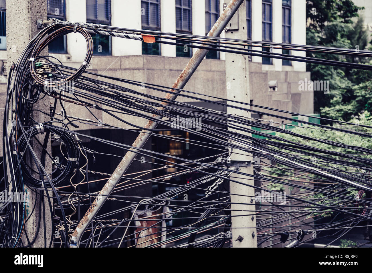 Messy electricity cables in Bangkok Thailand. Stock Photo