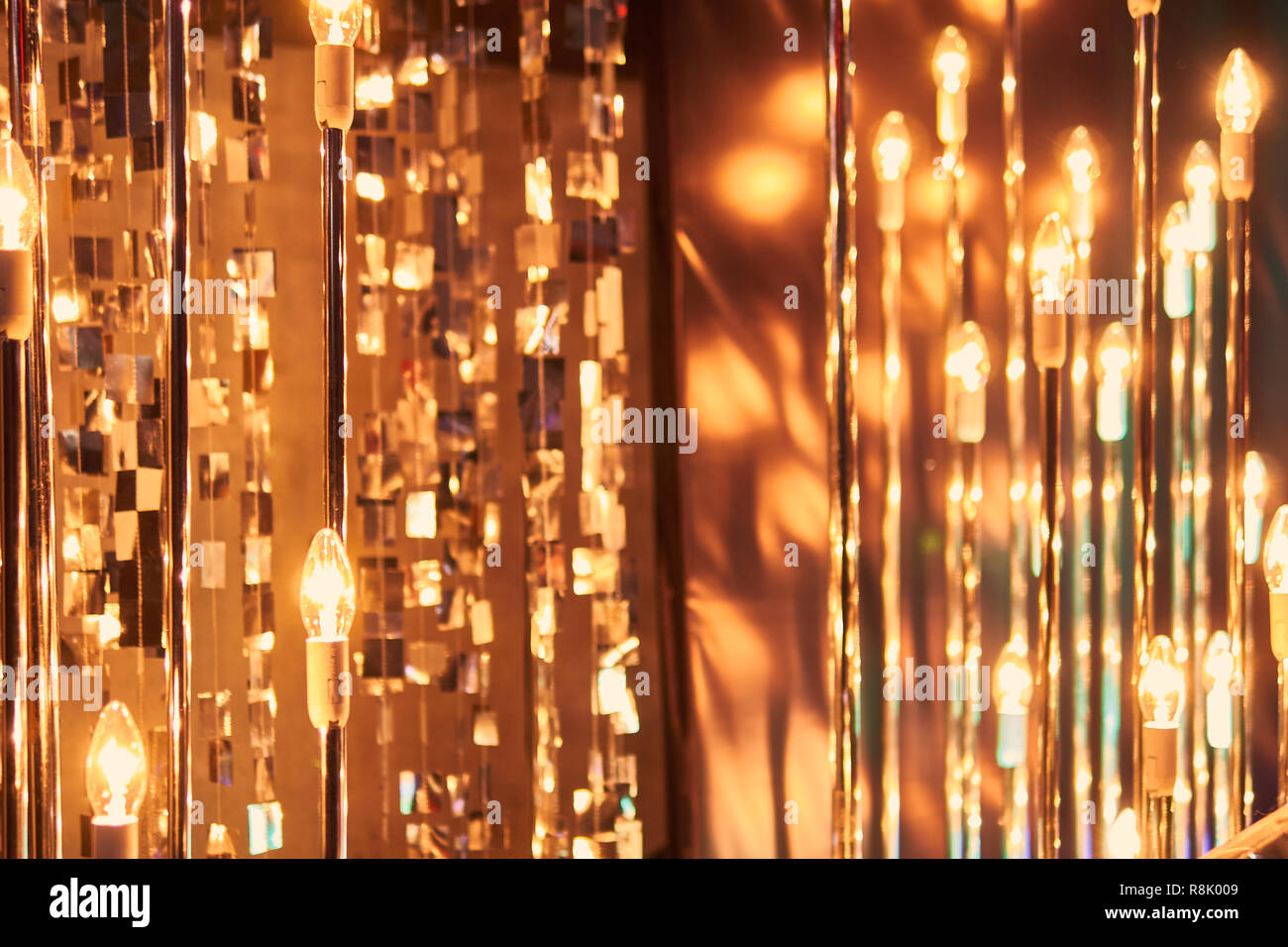 blurred defocused red bright light. lens flare. shiny spots. dark background Stock Photo