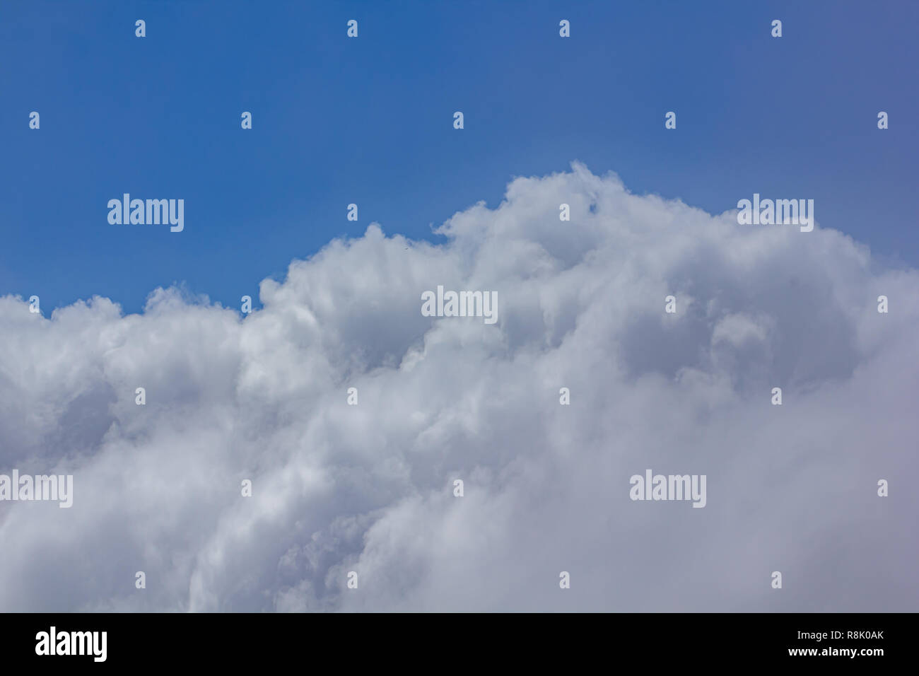 bright blue skys over dense cloud cover Stock Photo - Alamy