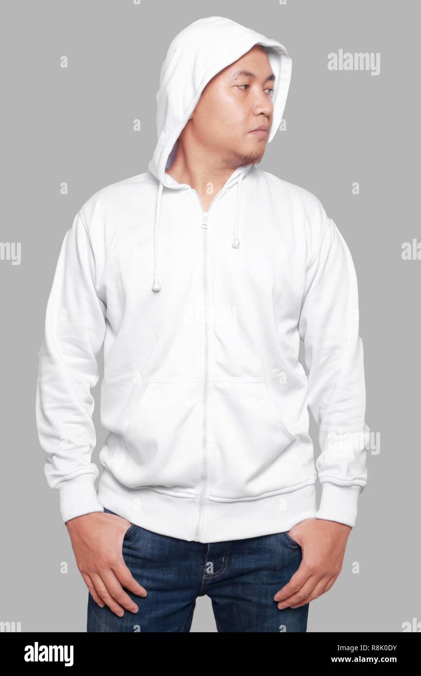 Blank sweatshirt mock up, front view, isolated on grey. Asian male model wear plain white hoodie mockup. Hoody design presentation. Jumper for print.  Stock Photo