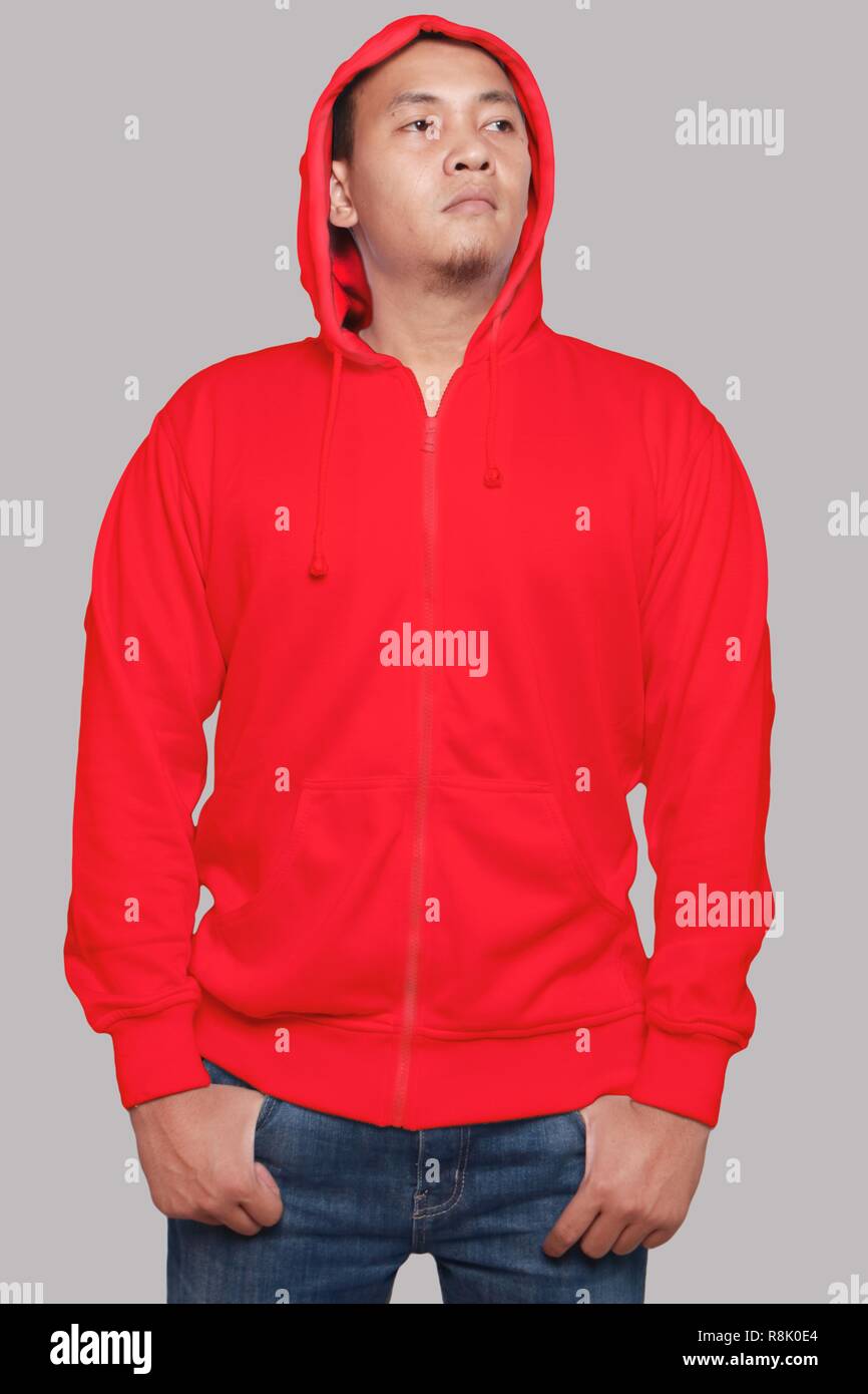 Blank sweatshirt mock up, front view, isolated on grey. Asian male model wear plain red hoodie mockup. Hoody design presentation. Jumper for print. Bl Stock Photo