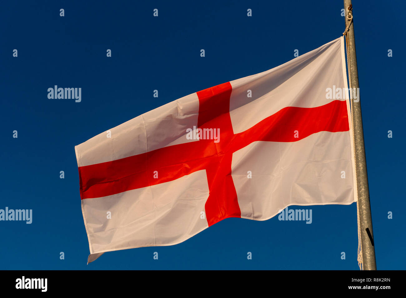 Isolated Waving English Flag Red Cross On White On Blue Sky