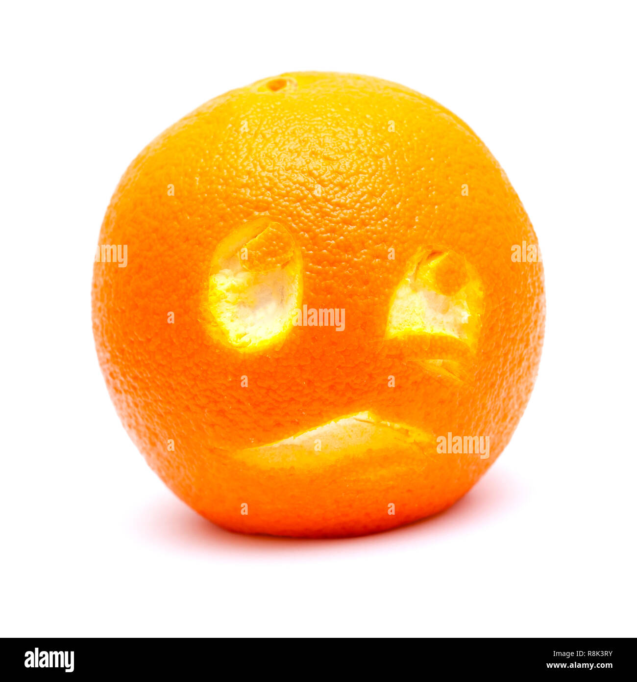 Orange with with a cut out funny face on ot Stock Photo
