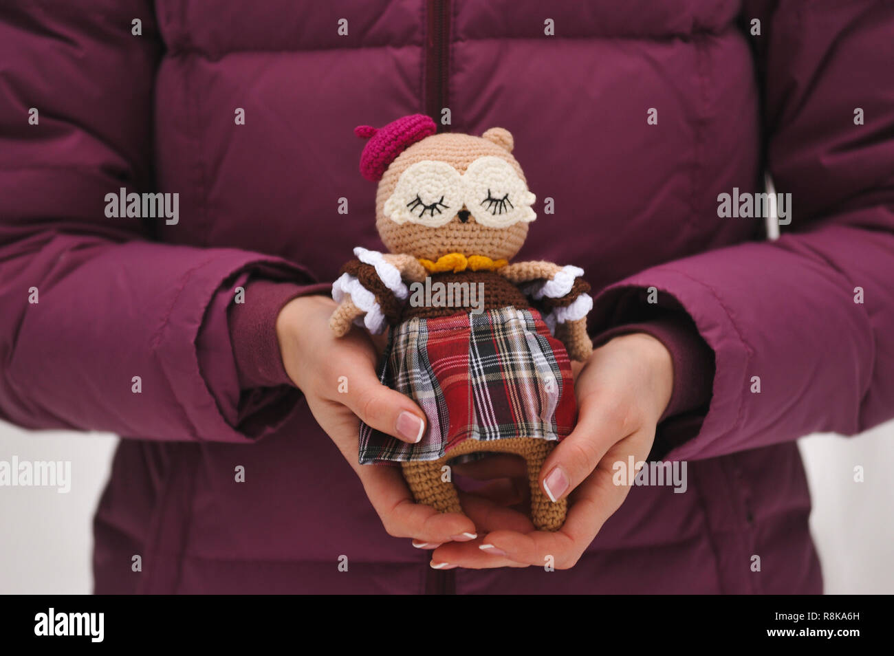 SYKTYVKAR, RUSSIA - DECEMBER 16, 2018: Illustrative image. Sleeping owl toy knitted in the technique of knitting amigurumi Stock Photo