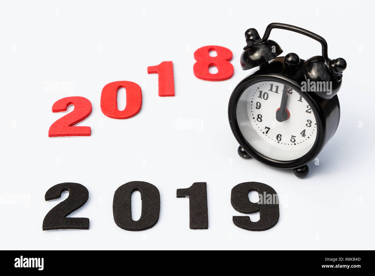 2018, 2019 and black alarm clock for new year Stock Photo