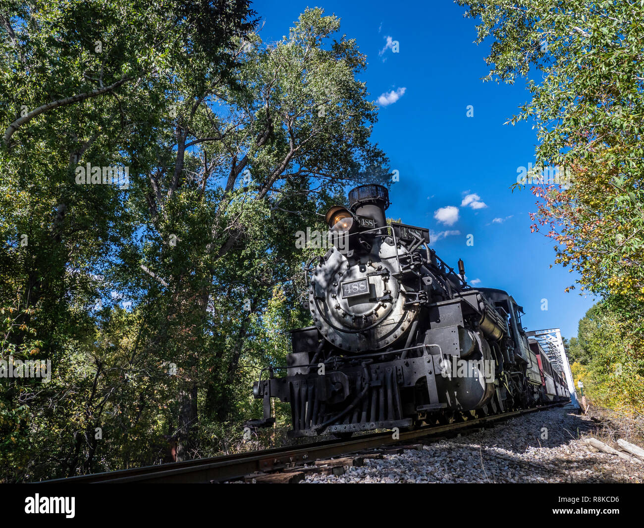 Train crosses the Chama River (Rio Chama), Cumbres & Toltec Scenic Railroad, Chama, New Mexico. Stock Photo