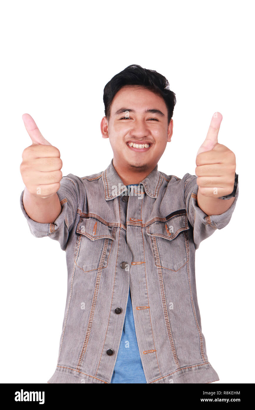 Photo image portrait of a cute young Asian man smiling and showing two ...