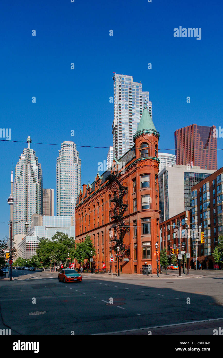 Canada, Province of Ontario, City of Toronto, Downtown, Front Street and Wellington Street East, Flatiron or Gooderham Building and in the background Brookfield Square and CN Tower Stock Photo