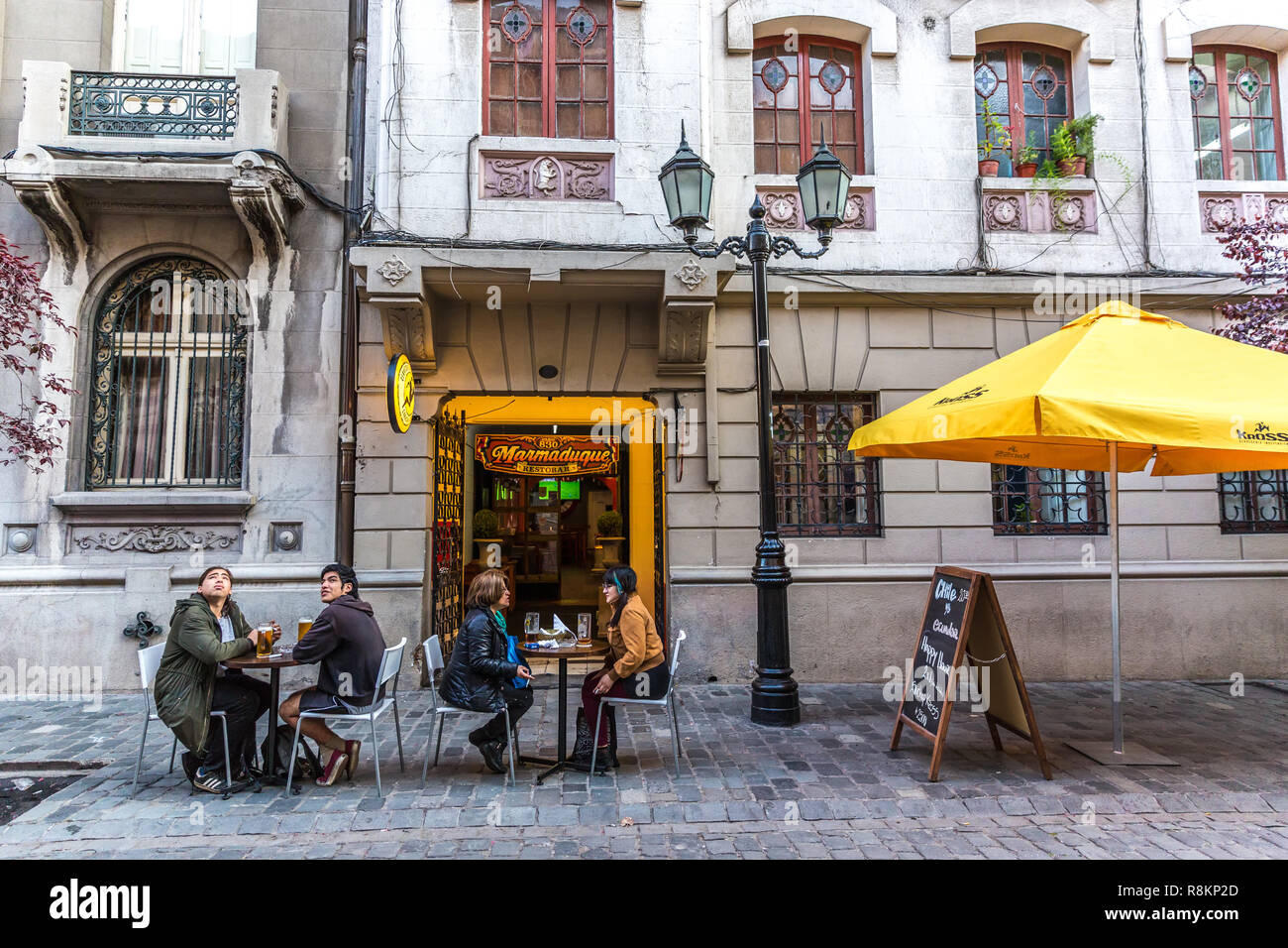 Santiago, Chile - Oct 15th 2017 - Tourists having a drink in an outside table in a charming cafe of Santiago del Chile in Chile Stock Photo