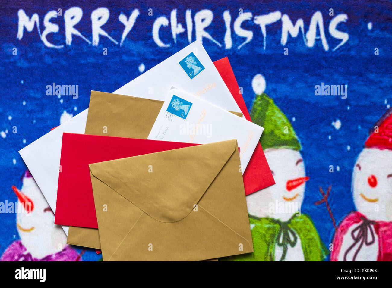 Envelopes, mail post, Christmas cards, on Christmas door mat Stock Photo