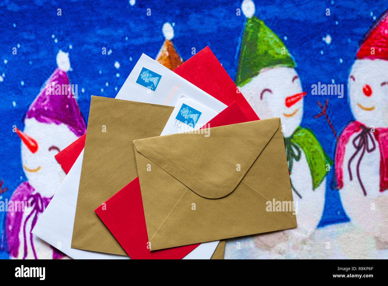 Envelopes, mail post, Christmas cards, on Christmas door mat Stock Photo