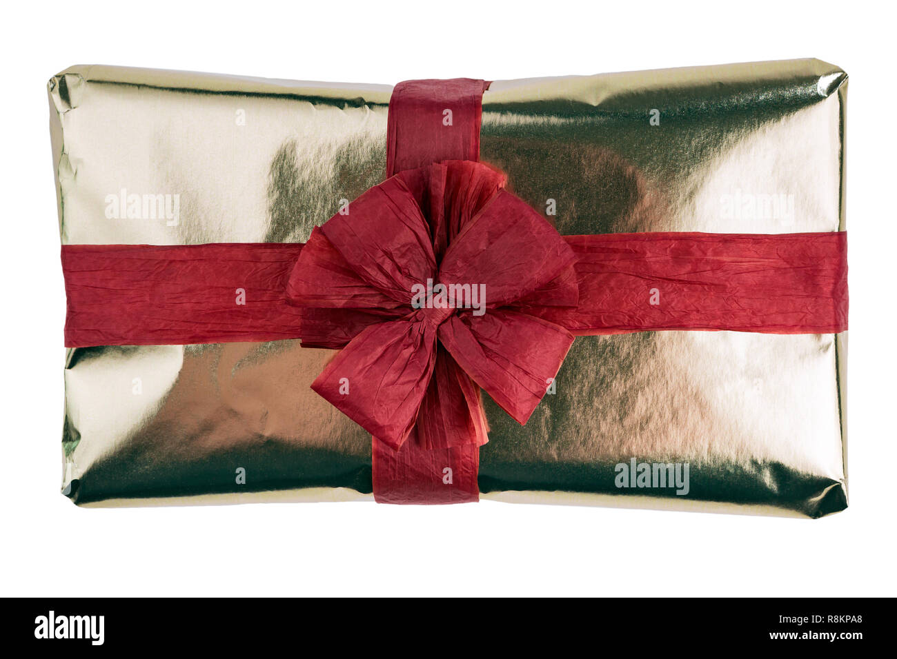 Gift box wrapped in gold wrapping paper, decorated with red raffia ribbon  and bow isolated on the white background Stock Photo - Alamy