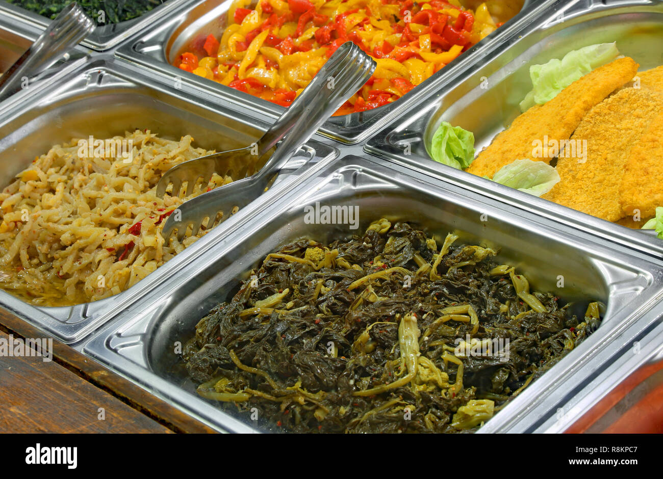 Grilled corn and baked potatoes stuffed with cheese in hotel pan on food  warmer. Self-service buffet table. Celebration, party, birthday or wedding  Stock Photo - Alamy