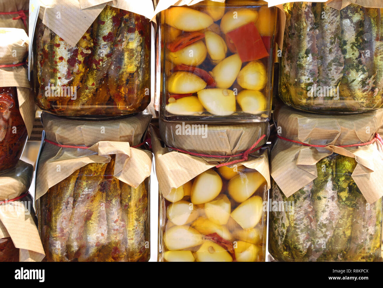 glass jars with spicy specialties typical of southern Italian regions such as anchovies and