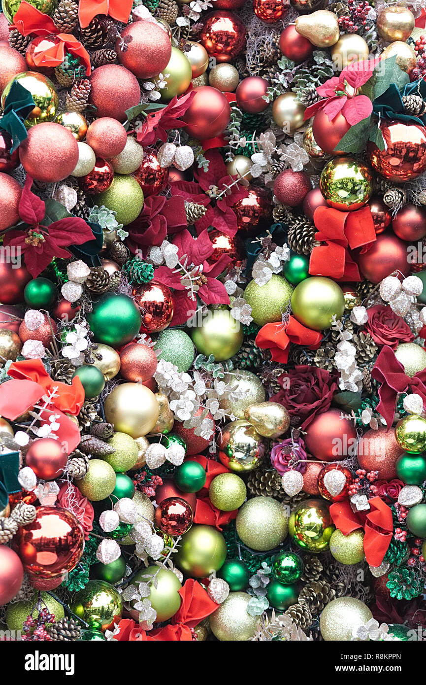 Christmas trees with brightly coloured baubles Stock Photo