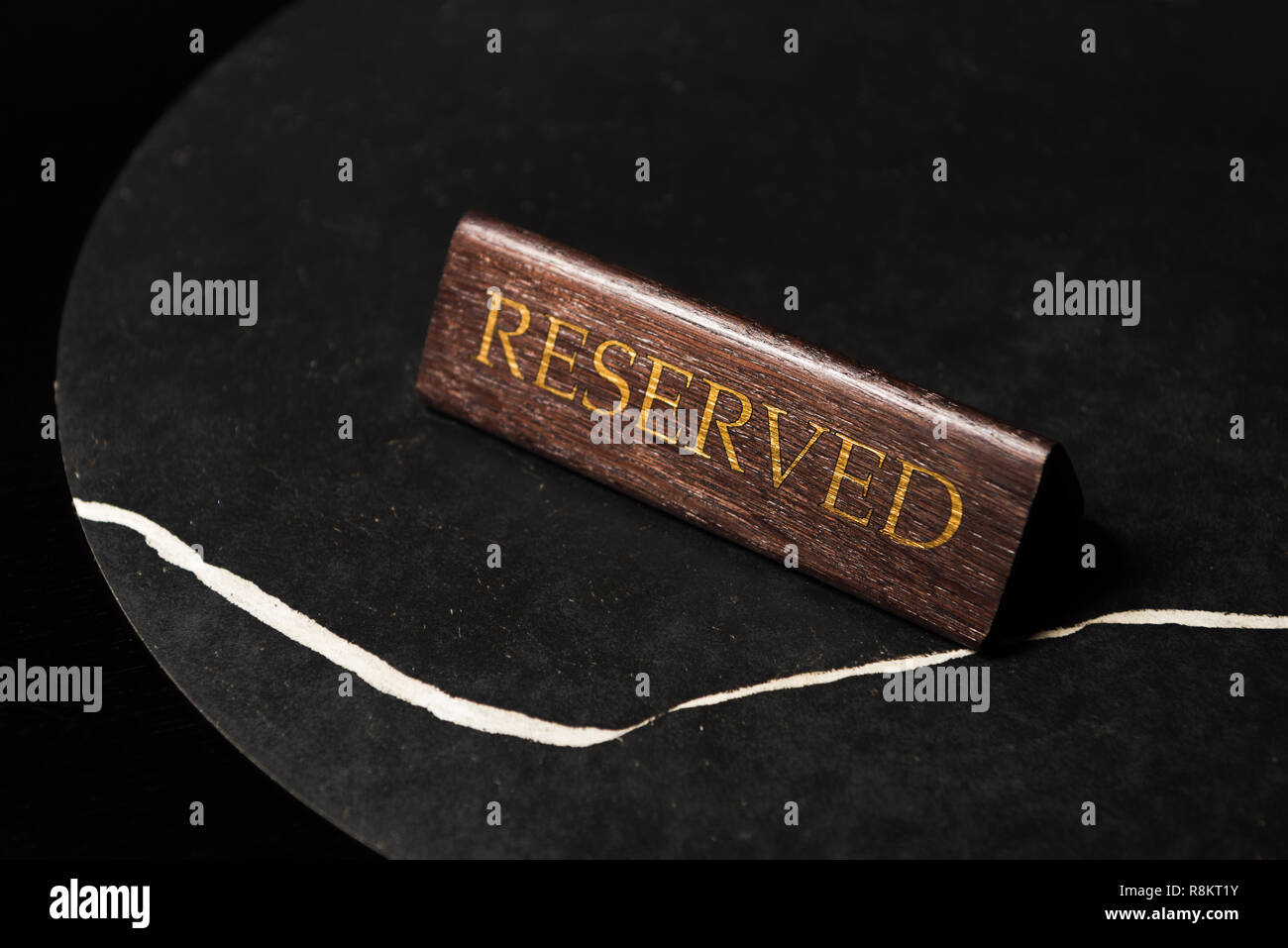 reserved sign on black table in cafe with copy space Stock Photo - Alamy