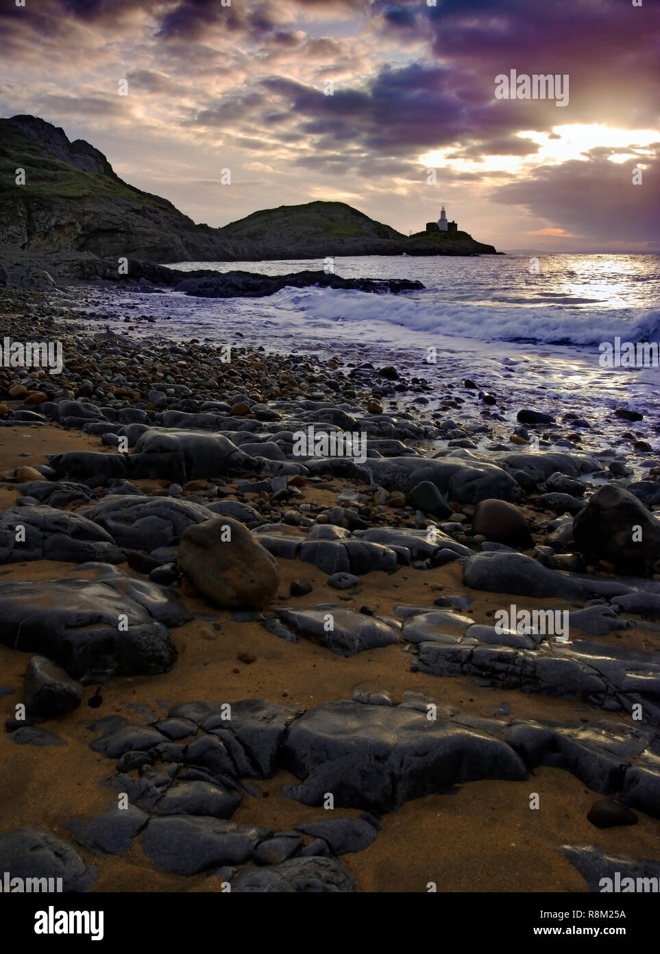 A dawn view of Mumbles Head in Swansea Bay, Wales. Stock Photo