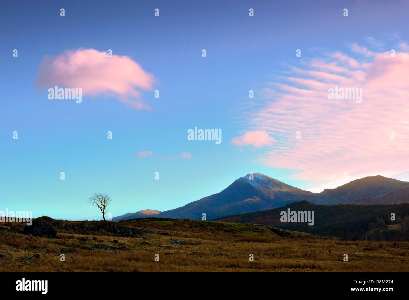 A winter's evening view of the sky and mountains in the Snowdonia National Park, Wales. Stock Photo