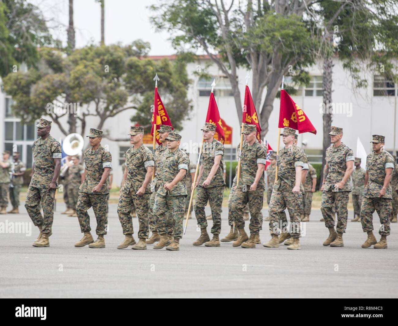U.S. Marines with 3rd Assault Amphibian Battalion, 1st Marine Division march during a relief and appointment, and retirement ceremony for Sgt. Maj. Christopher Slattery on Camp Pendleton, Calif., May 5, 2017. Sgt. Maj. Slattery relinquished his post as Sgt. Maj. of 3rd Assault Amphibian Battalion, 1st Marine Division before retiring after serving honorably for 30 years. Stock Photo