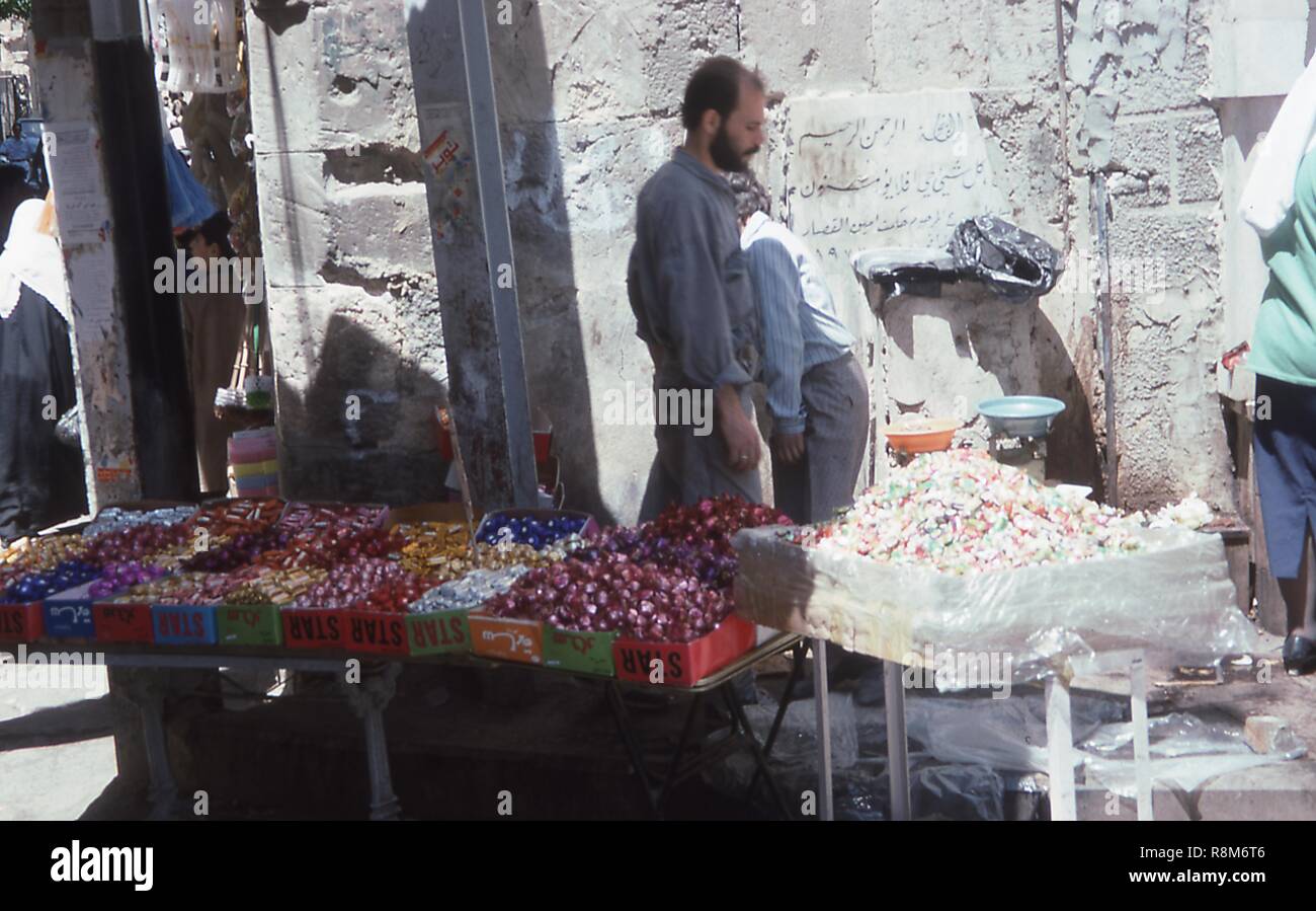 View of a candy seller's table at the Al-Hamidiyah souk in the Old City of Damascus, Syria, June, 1994. () Stock Photo