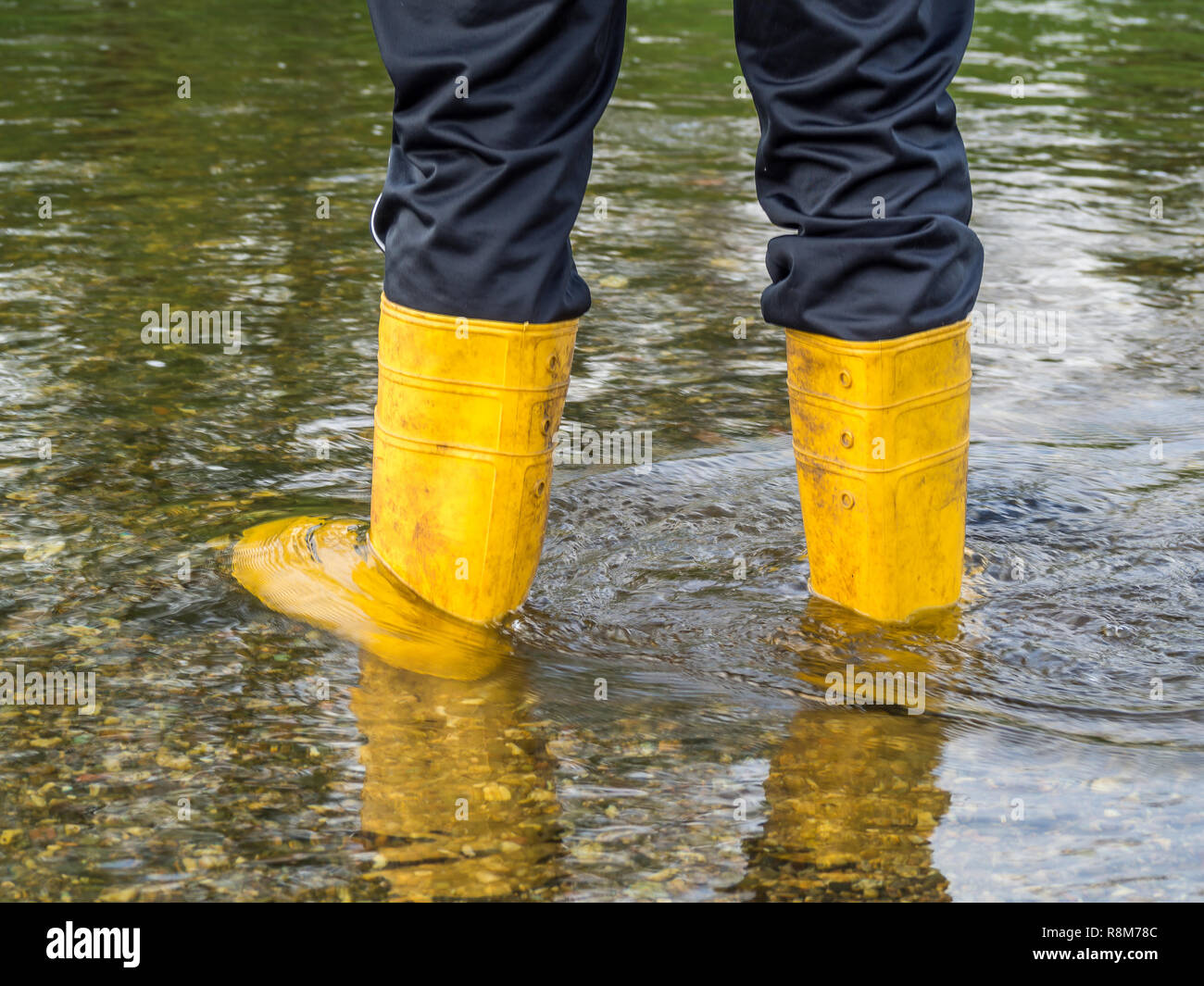 Wellies in the flood Stock Photo - Alamy