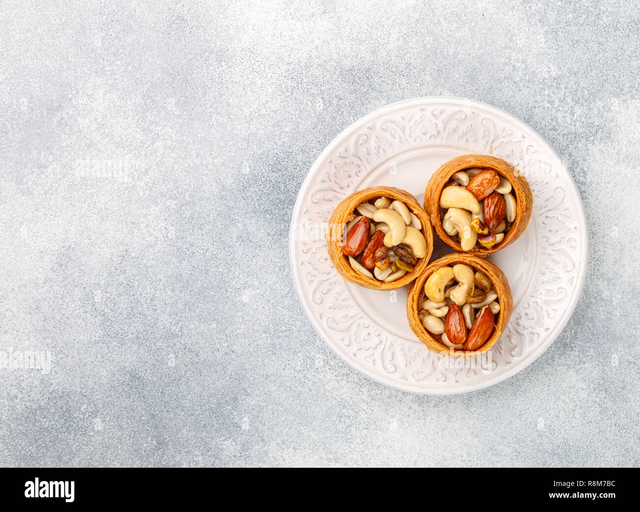 Traditional middle Eastern sweets "bird's nest" in honey syrup with nut