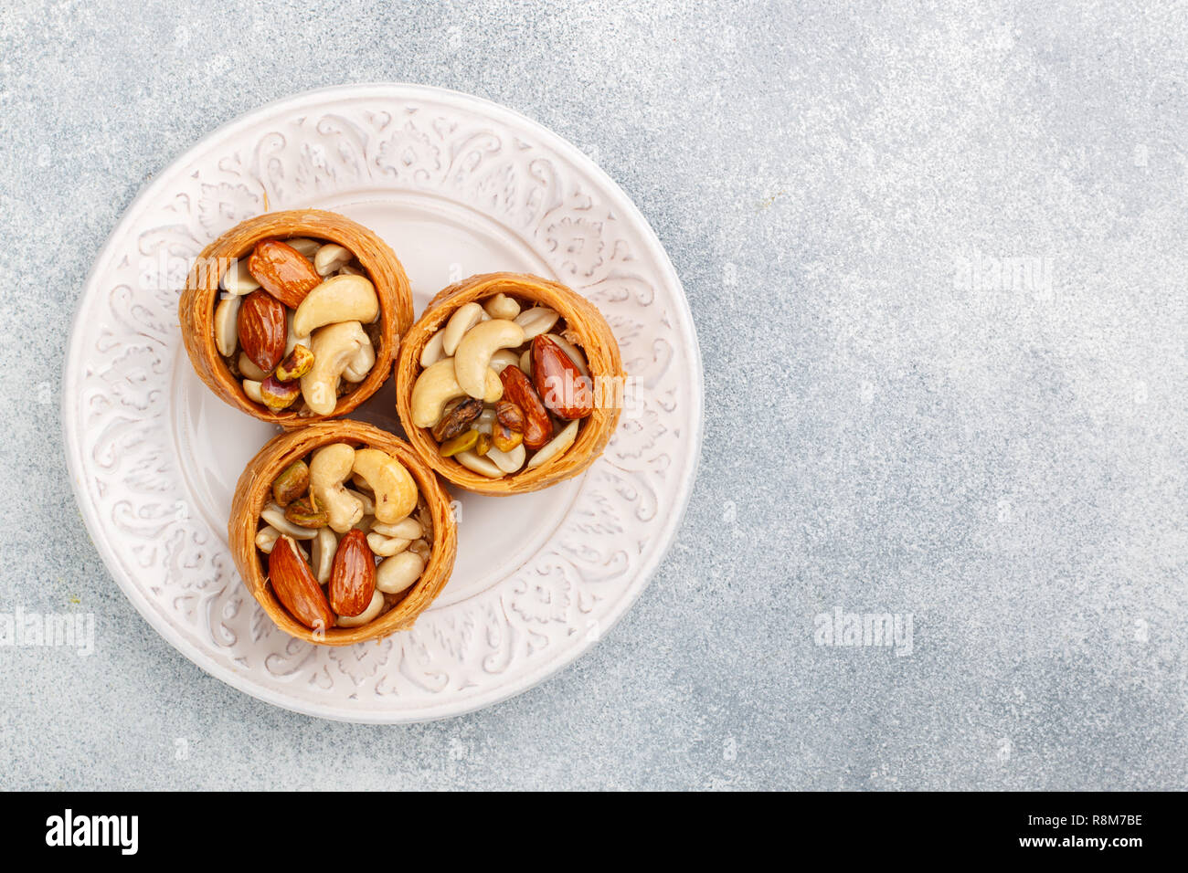 Traditional middle Eastern sweets "bird's nest" in honey syrup with nut
