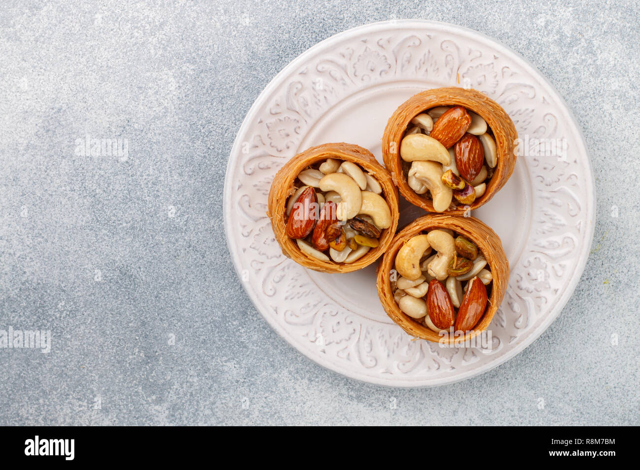 Traditional middle Eastern sweets "bird's nest" in honey syrup with nut