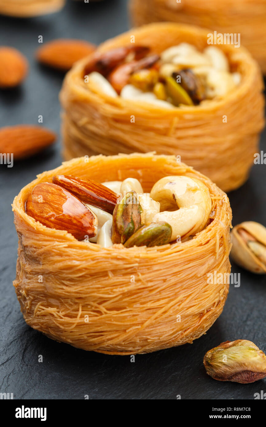 Traditional middle Eastern sweets "bird's nest" in honey syrup with nut