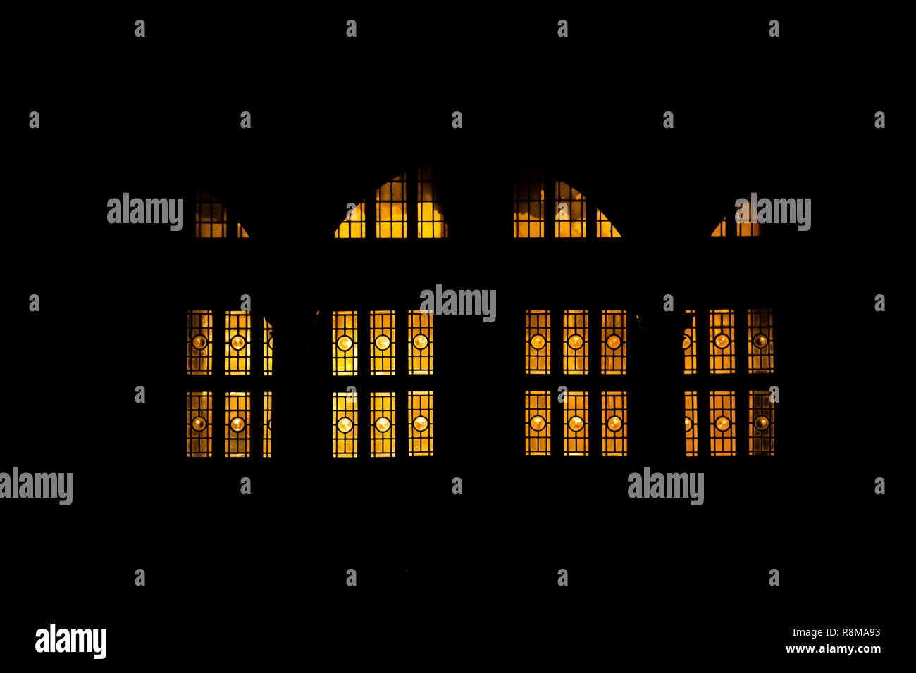 Yellow lights coming through the windows and doors Stock Photo Alamy