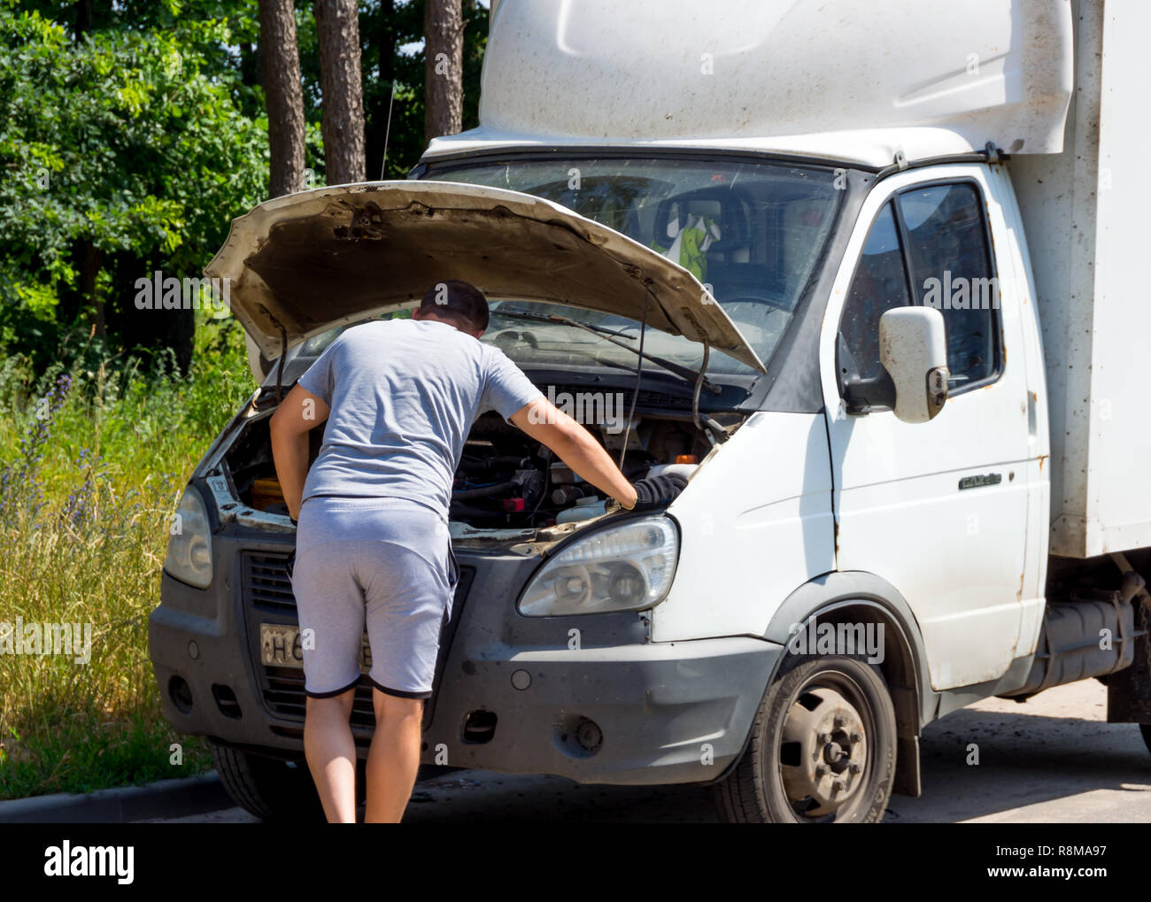 Voronezh, Russia - June 27, 2018: The driver determines the cause of the car breakdown Stock Photo