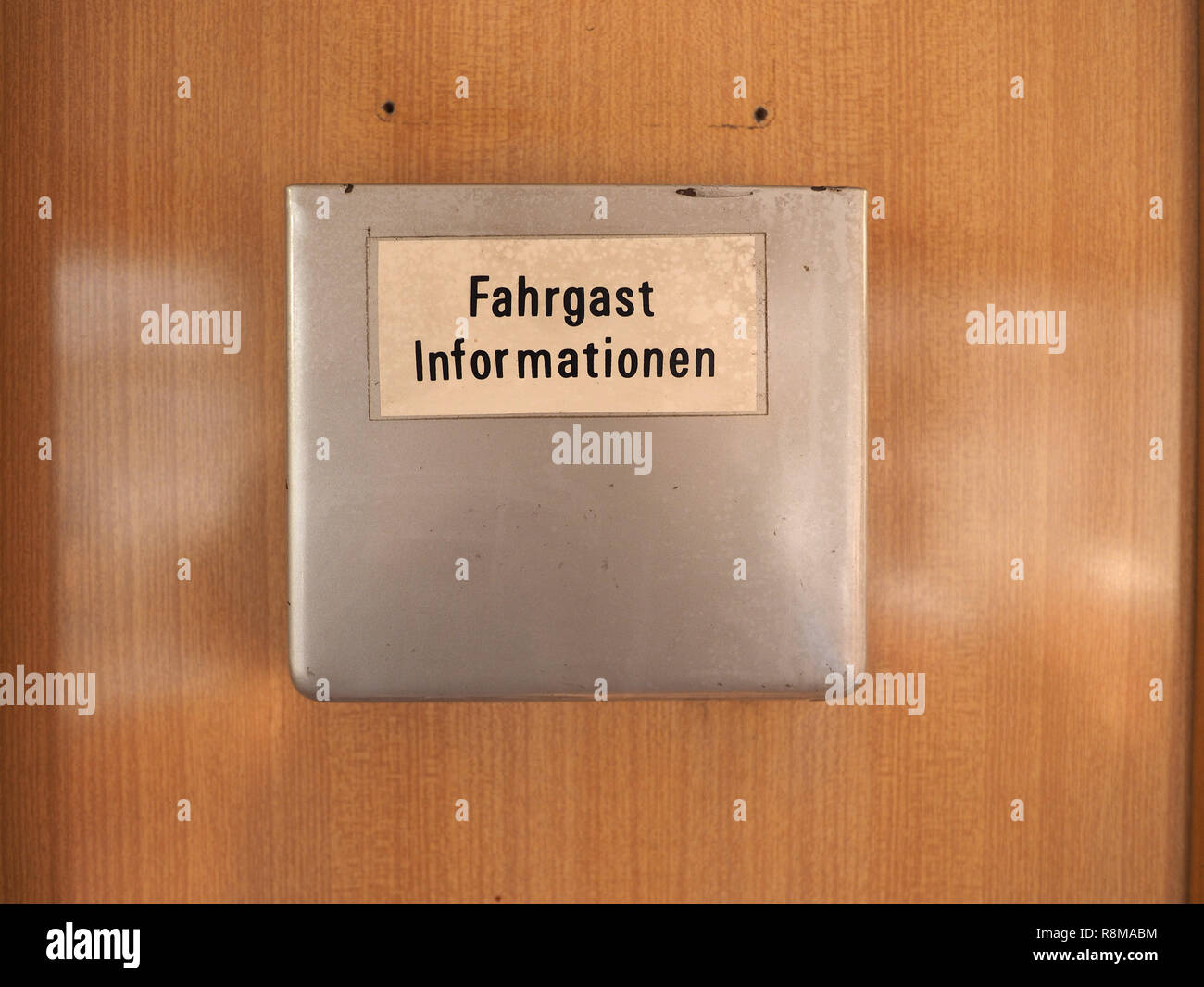 Fahrgast Informationen (meaning Passenger information) sign on vintage German tram Stock Photo