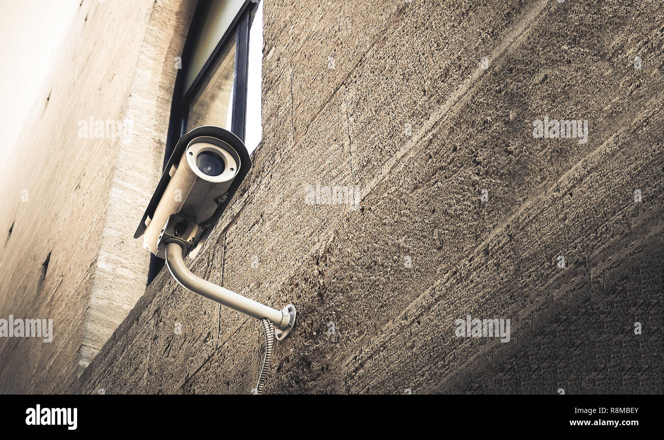 cctv security camera background spy street look wall Stock Photo