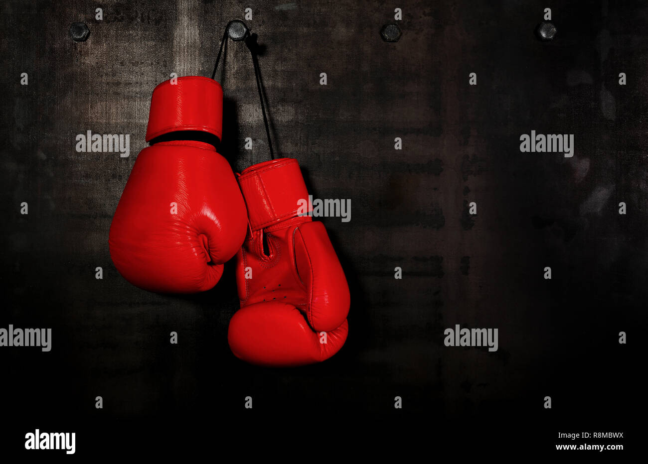 Hanging boxing gloves black background hires stock photography and
