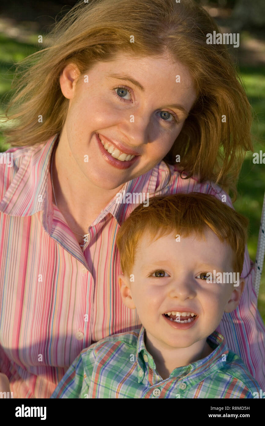 Family fun on a backyard swing, USA (part of a series Stock Photo Alamy