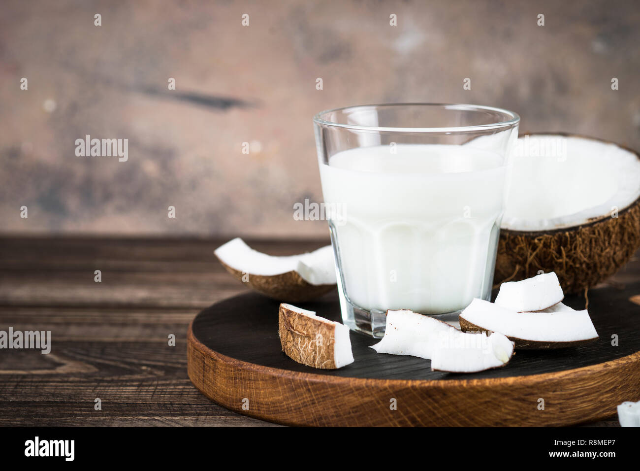 Coconut milk in glass, Vegan milk.  Stock Photo