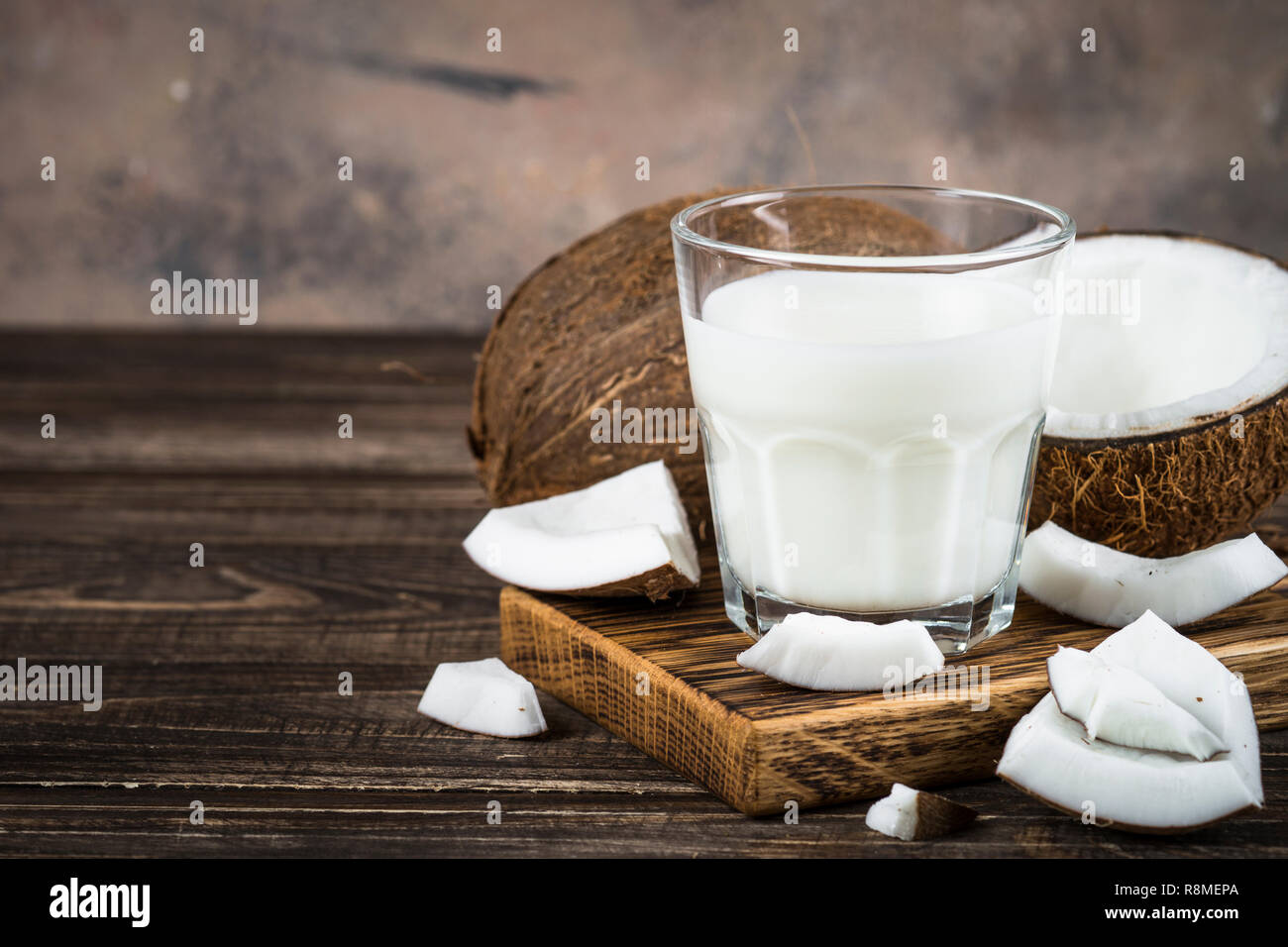 Coconut milk in glass, Vegan milk.  Stock Photo