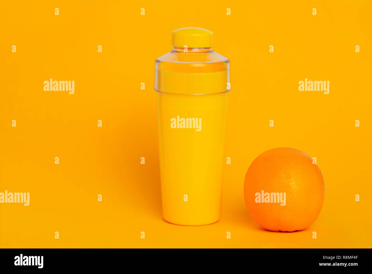 Download Yellow Bottle On A Yellow Background Next To An Orange Minimalism Stock Photo Alamy Yellowimages Mockups