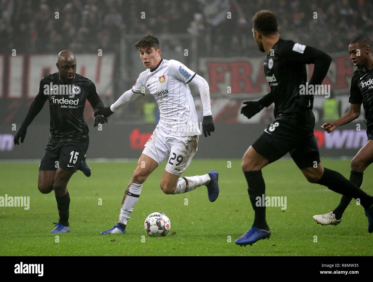Frankfurt, Germany. 16th Dec 2018. Soccer: Bundesliga, Eintracht Frankfurt - Bayer 04 Leverkusen, 15th matchday, in the Commerzbank Arena. Simon Falette (r) from Frankfurt in a duel with Kai Havertz (M) from Leverkusen. On the left runs Jetro Willems (Frankfurt). Photo: Hasan Bratic/dpa - IMPORTANT NOTE: In accordance with the requirements of the DFL Deutsche Fußball Liga or the DFB Deutscher Fußball-Bund, it is prohibited to use or have used photographs taken in the stadium and/or the match in the form of sequence images and/or video-like photo sequences. Credit: dpa picture alliance/Alamy Li Stock Photo