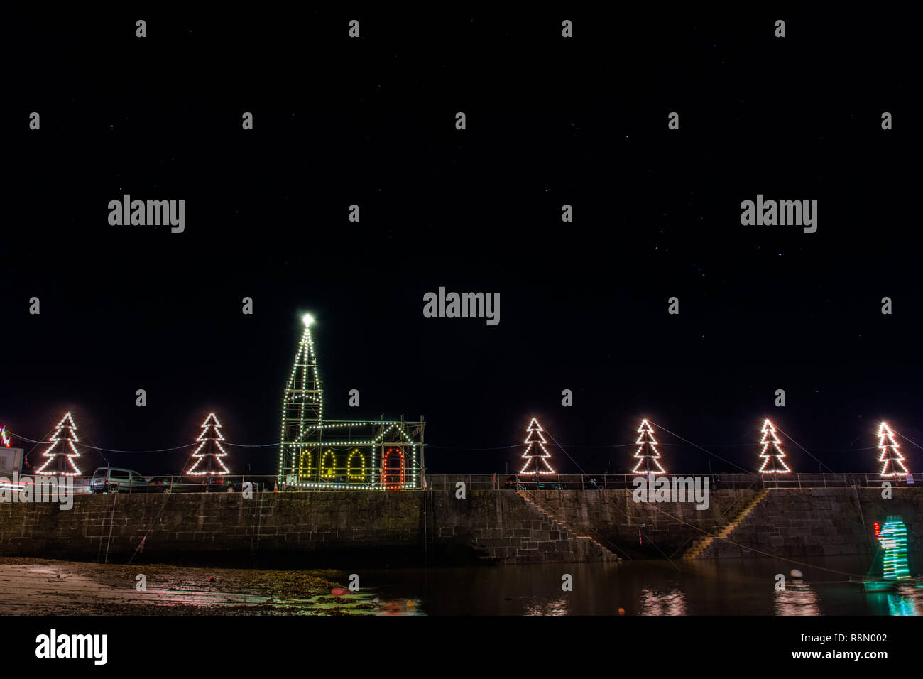 Mousehole Harbour lights at night lit up for the 2018 Christmas season